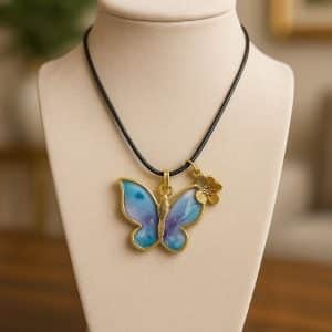 🦋 "Whimsical Wings" – Handcrafted Resin Butterfly Pendant Necklace with Gold Flower Charm