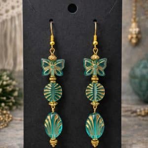 🦋 "Teal Transformation" – Artisan Gold Earrings with Etched Butterfly and Sunburst Beads