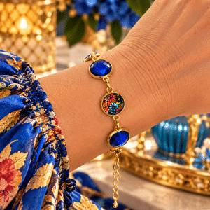 💙🌺 Royal Garden of Grace – Sapphire-Blue Gem & loral, Gold-Tone Bezel Link Bracelet